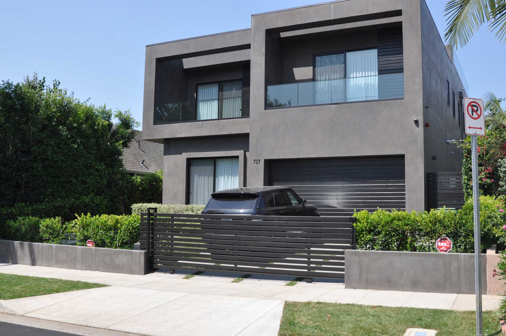 Modern home with an iron gate from Precise Iron Doors