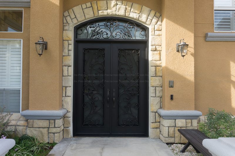 Wrought iron double entry doors with sidelights