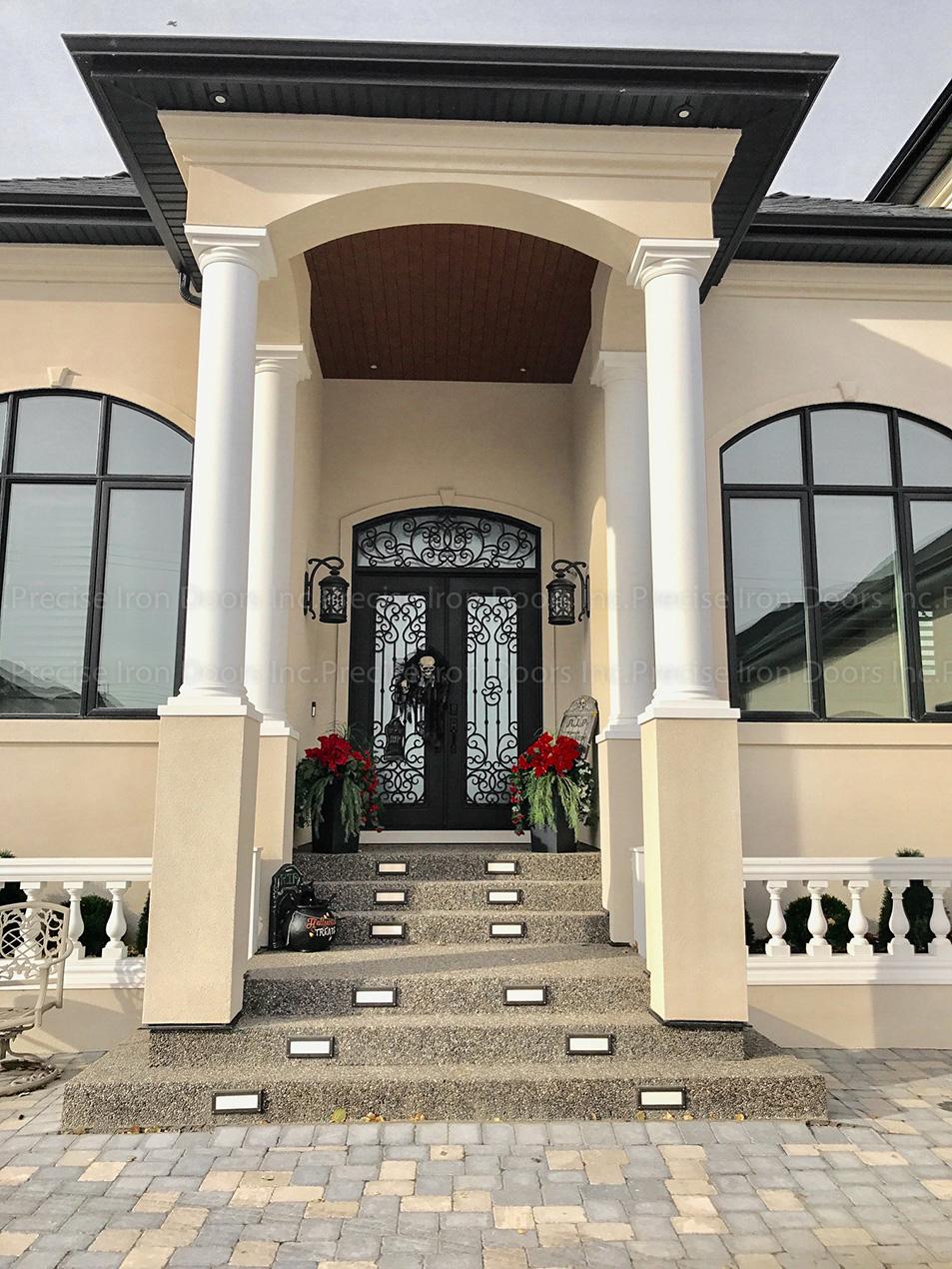 Ornate wrought iron double entry doors
