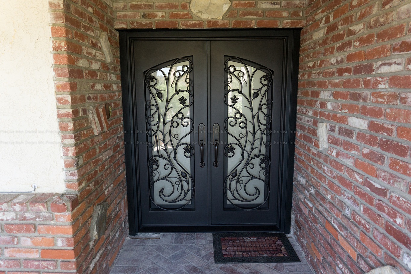 Custom iron door from Precise Iron Doors made for a ranch style home