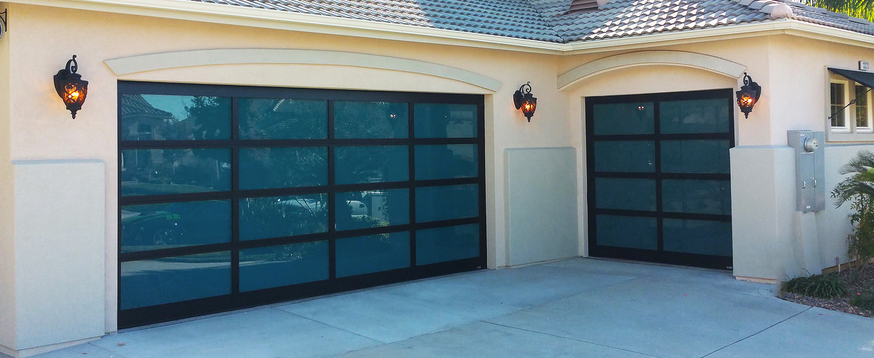 Aluminum garage doors with dual pane glass on a beautiful home