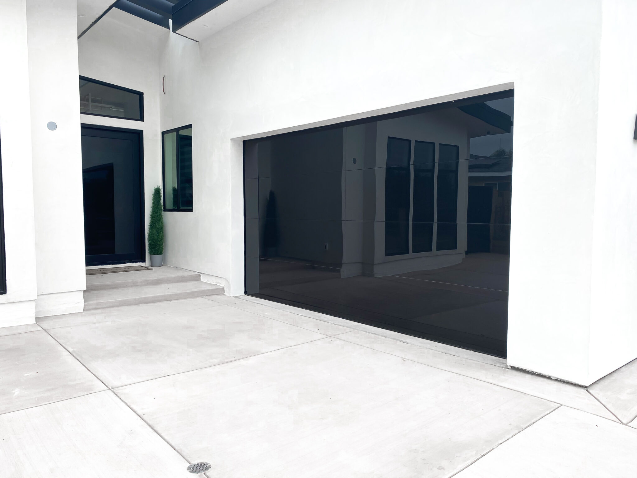 Frameless garage door design from Precise Iron Doors