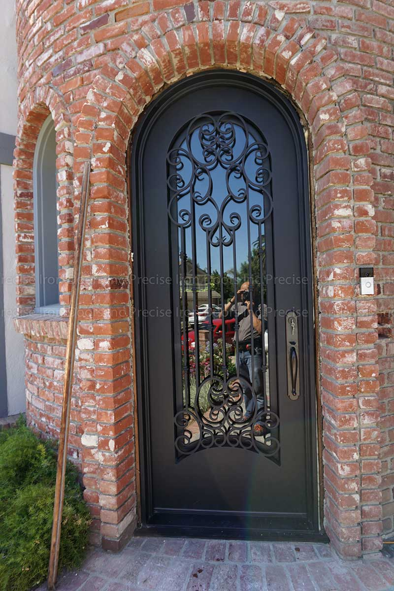 Historic brick home with beautiful iron door
